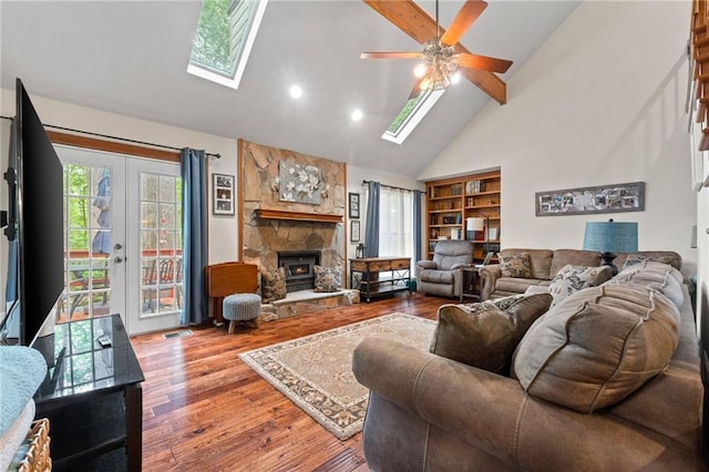 110 The Farm Rd, Mcdonough, GA 30252 - living area featuring a ceiling fan, a skylight, and wood finished floors