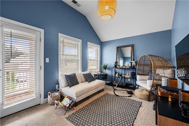 240 Daisy Cir, Mcdonough, GA 30252 - carpeted living area featuring lofted ceiling and baseboards