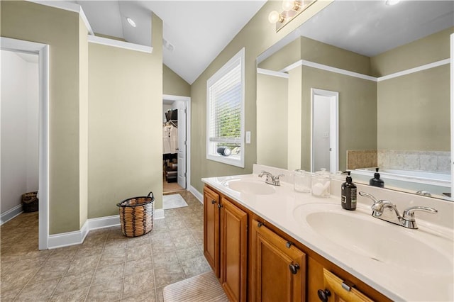 240 Daisy Cir, Mcdonough, GA 30252 - bathroom featuring lofted ceiling, double vanity, a garden tub, and tile patterned flooring