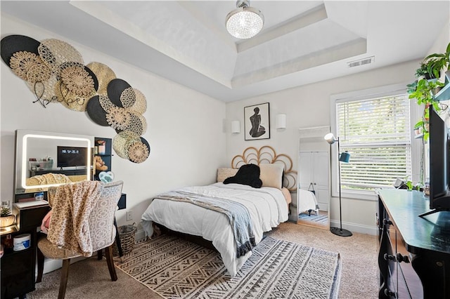 240 Daisy Cir, Mcdonough, GA 30252 - carpeted bedroom with a tray ceiling and baseboards