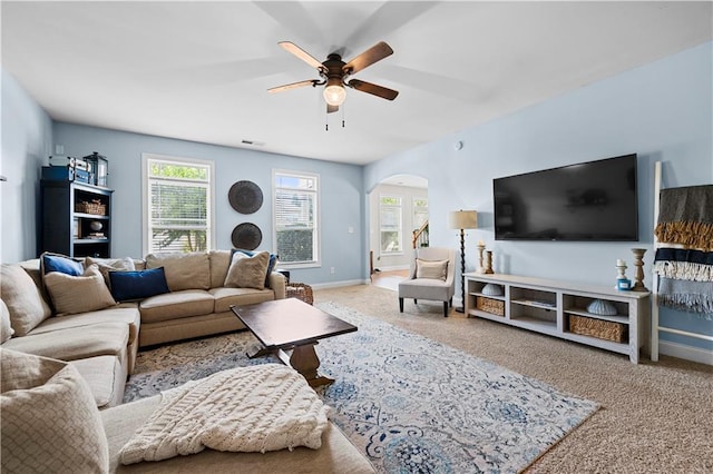 240 Daisy Cir, Mcdonough, GA 30252 - living room with a ceiling fan, arched walkways, and carpet floors