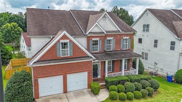 5280 Lakerock Way S, Fulton, GA 30331 - traditional home with brick siding, a porch, roof with shingles, and concrete driveway