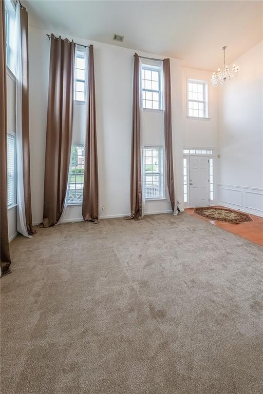 5280 Lakerock Way S, Fulton, GA 30331 - carpeted foyer entrance featuring a chandelier