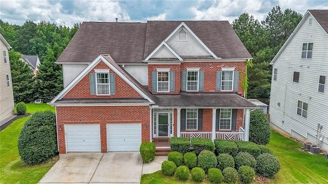 5280 Lakerock Way S, Fulton, GA 30331 - view of front of house with brick siding, covered porch, driveway, and a shingled roof