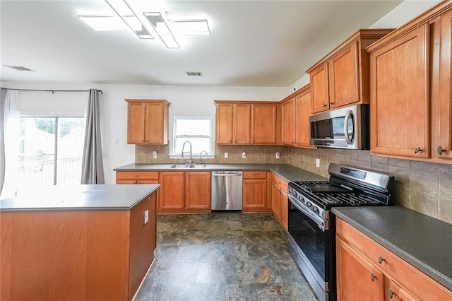 5280 Lakerock Way S, Fulton, GA 30331 - kitchen featuring stainless steel appliances, decorative backsplash, brown cabinets, and dark countertops