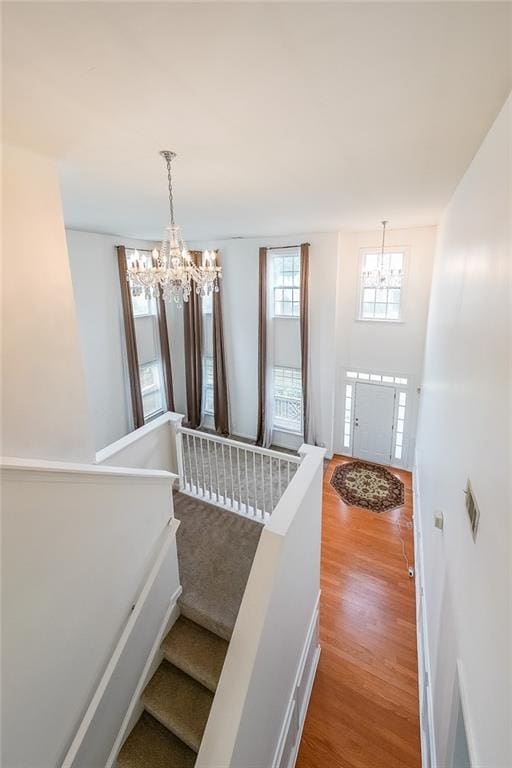 5280 Lakerock Way S, Fulton, GA 30331 - stairs featuring a chandelier and wood finished floors