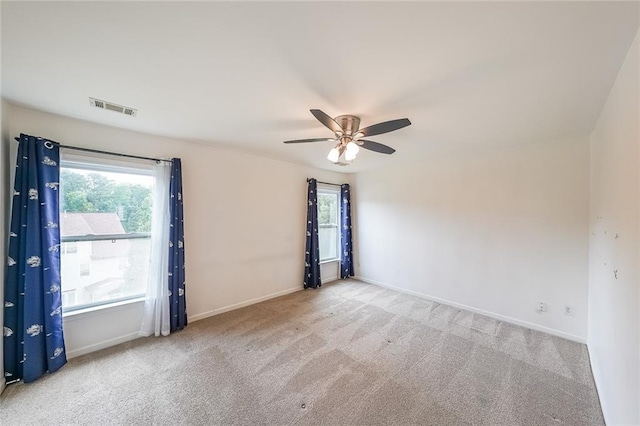 5280 Lakerock Way S, Fulton, GA 30331 - empty room featuring carpet flooring, plenty of natural light, and a ceiling fan