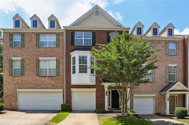 5126 Wellsley Bnd, Alpharetta, GA 30005 - townhome / multi-family property with a garage, driveway, and brick siding