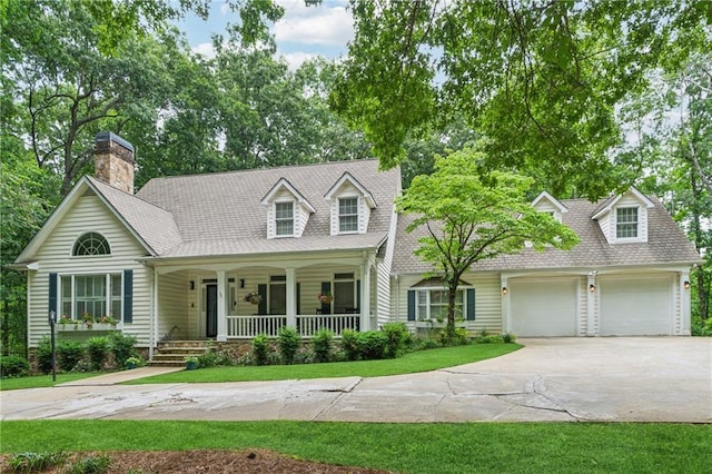 34 Johnston Row NW, Cartersville, GA 30121 - cape cod-style house with covered porch, concrete driveway, a garage, and a shingled roof