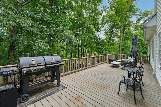 34 Johnston Row NW, Cartersville, GA 30121 - wooden terrace with grilling area, an outdoor living space, and view of scattered trees