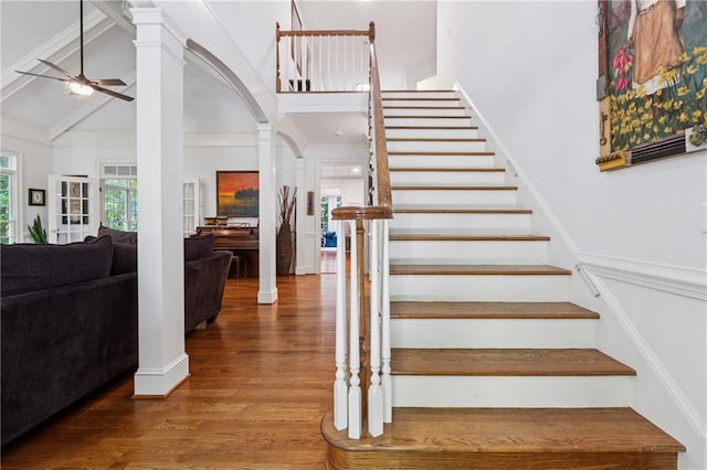 34 Johnston Row NW, Cartersville, GA 30121 - staircase featuring ornate columns, a ceiling fan, wood finished floors, arched walkways, and high vaulted ceiling