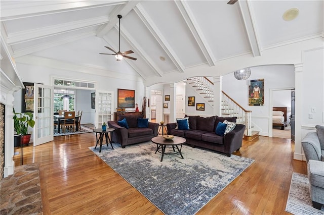 34 Johnston Row NW, Cartersville, GA 30121 - living area with ceiling fan, stairs, ornate columns, arched walkways, and wood finished floors