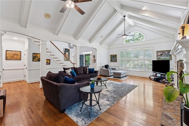34 Johnston Row NW, Cartersville, GA 30121 - living room with a ceiling fan, ornate columns, stairs, and healthy amount of natural light