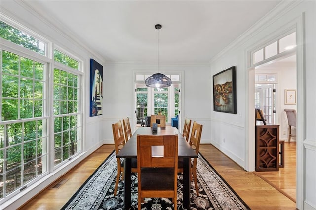 34 Johnston Row NW, Cartersville, GA 30121 - dining area featuring light wood-type flooring and crown molding