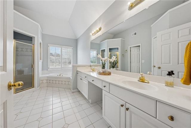 full bathroom featuring double vanity, a garden tub, vaulted ceiling, a shower stall, and a sink