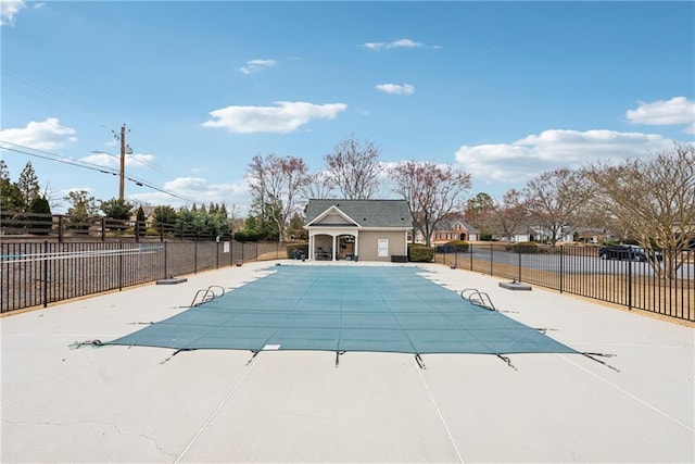 pool featuring a patio area and fence