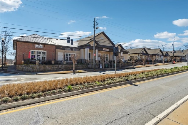 view of property with fence and a residential view