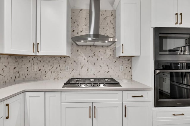 1547 Trilogy Park, Hoschton, GA 30548 - kitchen with wall chimney range hood, black oven, stainless steel gas cooktop, white cabinetry, and built in microwave