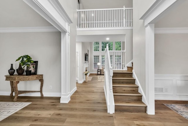 1547 Trilogy Park, Hoschton, GA 30548 - entrance foyer with stairs, crown molding, wood finished floors, and baseboards