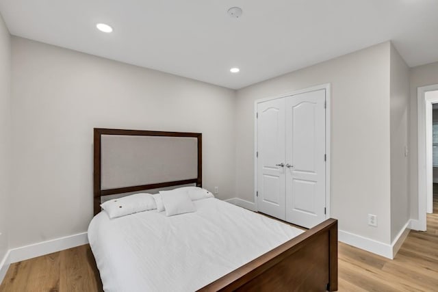 1547 Trilogy Park, Hoschton, GA 30548 - bedroom featuring baseboards, light wood-style floors, a closet, and recessed lighting