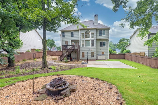 1547 Trilogy Park, Hoschton, GA 30548 - rear view of house featuring a fire pit, a patio area, a chimney, stairs, and a deck