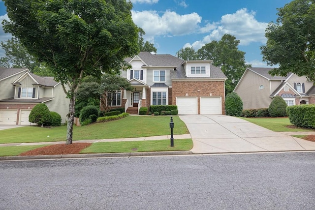 1547 Trilogy Park, Hoschton, GA 30548 - view of front of house with brick siding, concrete driveway, a front yard, and a garage