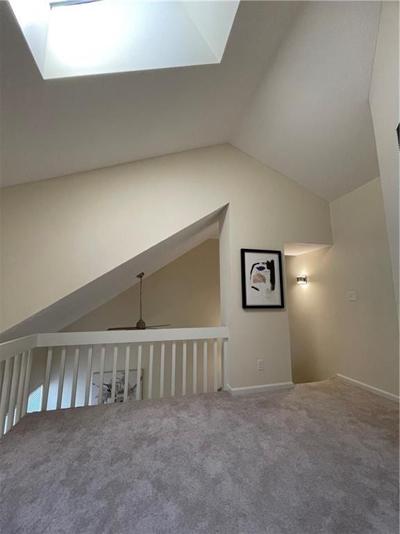 bonus room with carpet floors, ceiling fan, and lofted ceiling