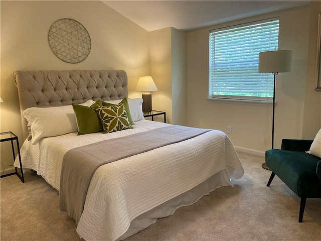 bedroom featuring carpet floors and baseboards