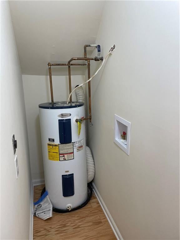 utility room featuring water heater