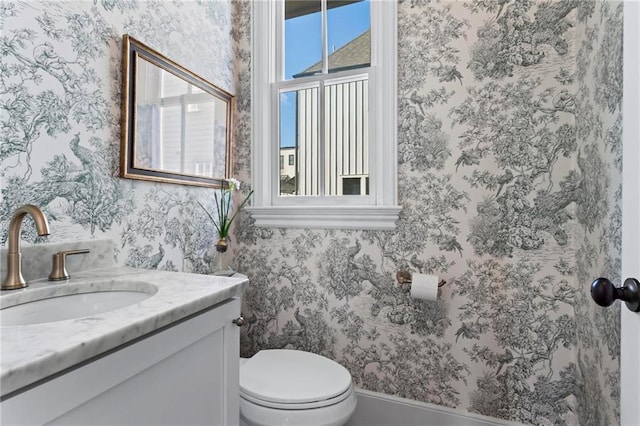 bathroom with vanity and toilet