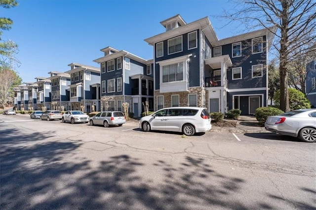 exterior space with a residential view and stone siding