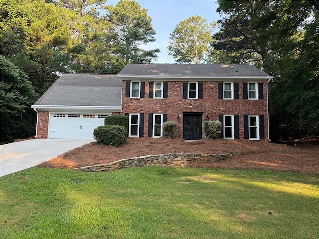 3375 Rivendell Ct, Roswell, GA 30075 - colonial home featuring concrete driveway, a front yard, brick siding, and a garage