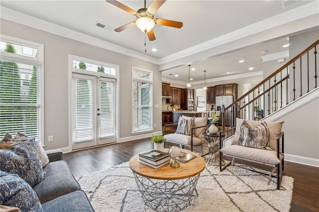 living area featuring visible vents, dark wood finished floors, stairway, and baseboards