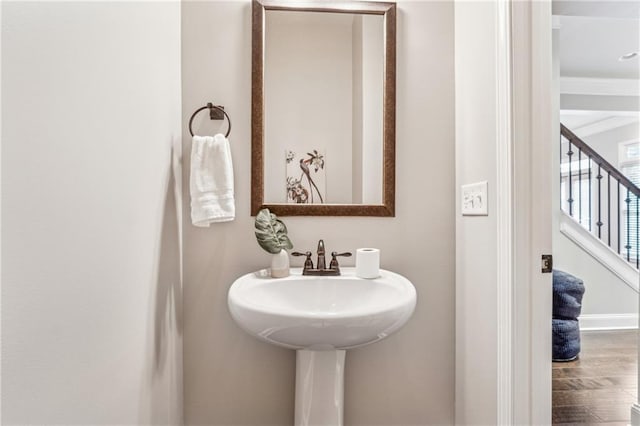 bathroom featuring wood finished floors and baseboards