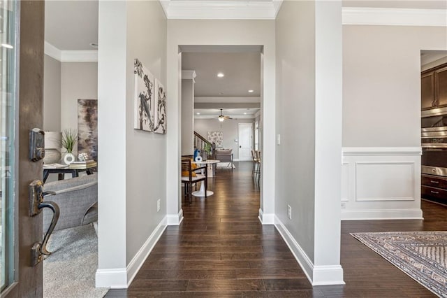 entryway with recessed lighting, crown molding, baseboards, and wood finished floors