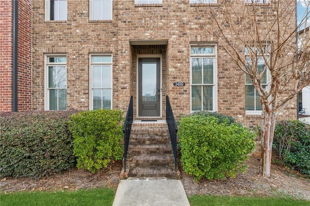 entrance to property with brick siding