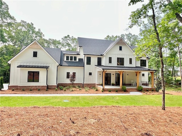 356 Henry Scott Rd, Ball Ground, GA 30107 - modern inspired farmhouse with a standing seam roof, a porch, a shingled roof, board and batten siding, and metal roof