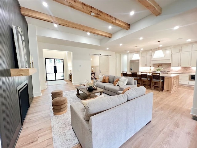 356 Henry Scott Rd, Ball Ground, GA 30107 - living area featuring a barn door, light wood finished floors, beamed ceiling, recessed lighting, and baseboards