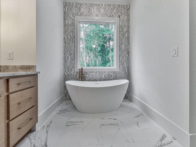 356 Henry Scott Rd, Ball Ground, GA 30107 - bathroom featuring baseboards, a freestanding tub, marble finish floors, and vanity