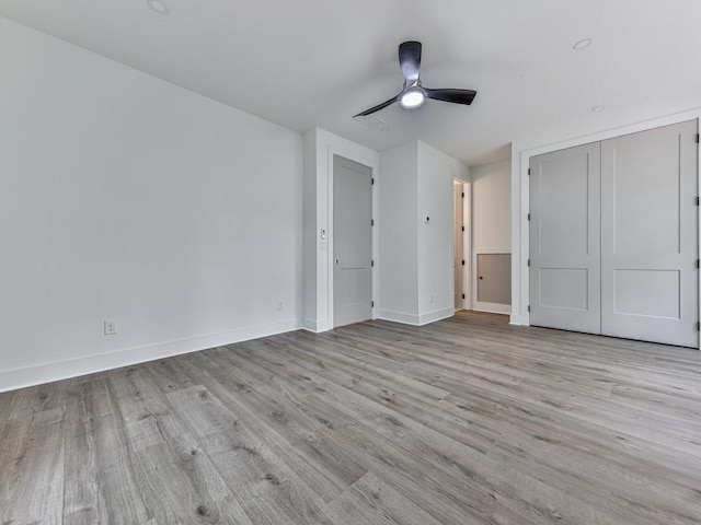356 Henry Scott Rd, Ball Ground, GA 30107 - unfurnished bedroom featuring wood finished floors, baseboards, and a ceiling fan