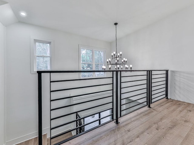 356 Henry Scott Rd, Ball Ground, GA 30107 - stairway featuring wood finished floors, a chandelier, healthy amount of natural light, and recessed lighting