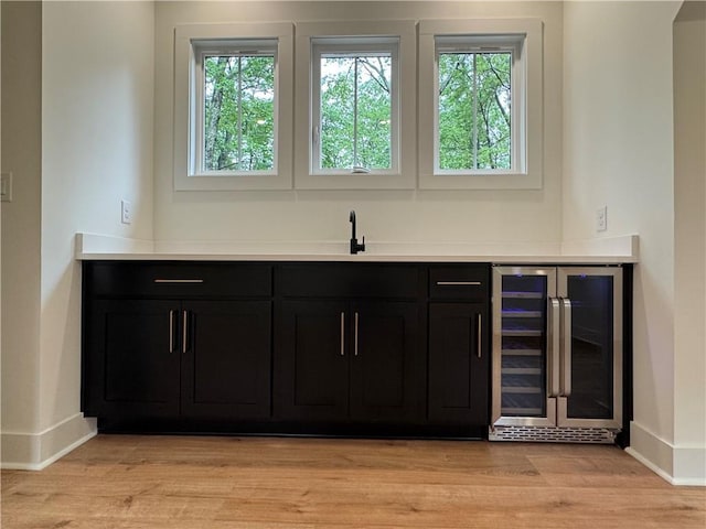 356 Henry Scott Rd, Ball Ground, GA 30107 - bar area featuring wine cooler, baseboards, a sink, and healthy amount of natural light