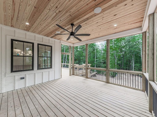 356 Henry Scott Rd, Ball Ground, GA 30107 - wooden deck with a ceiling fan, a sunroom, and view of scattered trees