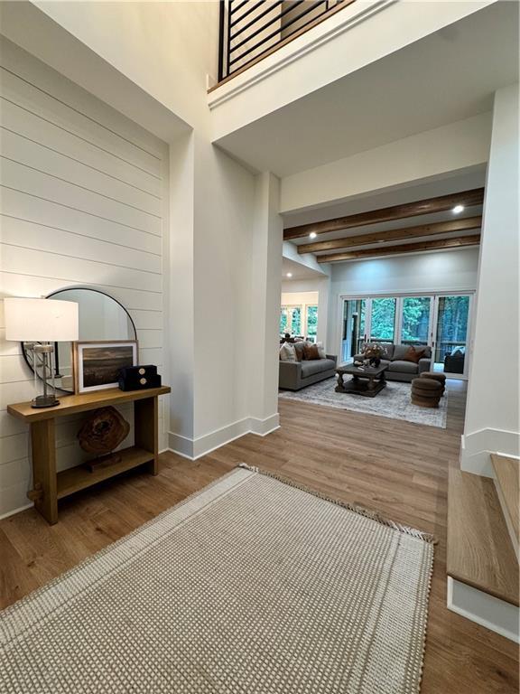 356 Henry Scott Rd, Ball Ground, GA 30107 - corridor with wood finished floors, baseboards, recessed lighting, and beam ceiling