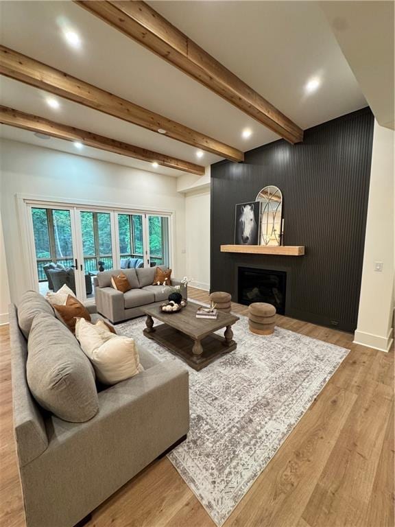 356 Henry Scott Rd, Ball Ground, GA 30107 - living area featuring beamed ceiling, a fireplace, wood finished floors, recessed lighting, and baseboards