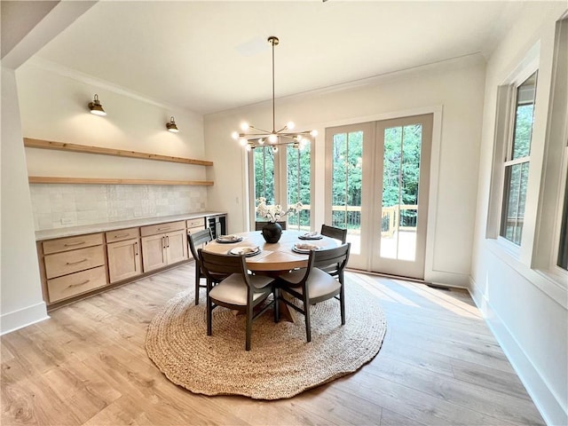 356 Henry Scott Rd, Ball Ground, GA 30107 - dining room featuring light wood-style floors, a chandelier, ornamental molding, and baseboards