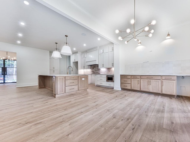 356 Henry Scott Rd, Ball Ground, GA 30107 - kitchen with a chandelier, tasteful backsplash, light wood-type flooring, and recessed lighting