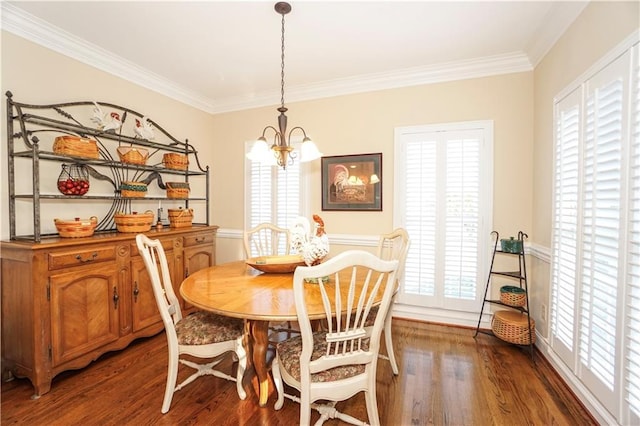 dining area with a chandelier, dark hardwood / wood-style floors, plenty of natural light, and crown molding