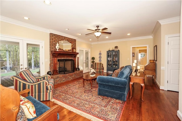 living room with dark hardwood / wood-style floors, ceiling fan, and ornamental molding