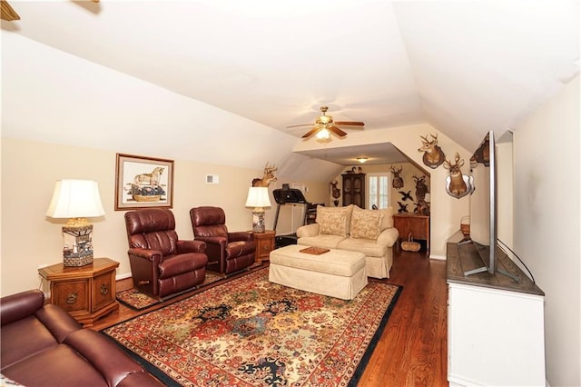 living room with ceiling fan, dark hardwood / wood-style flooring, and lofted ceiling